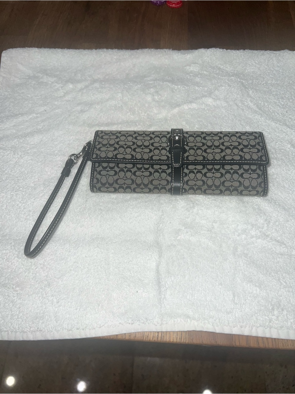Coach Black/Tan Signature Canvas Wristlet Clutch.